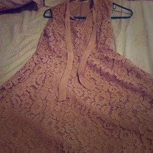 A muted pink sleeveless dress